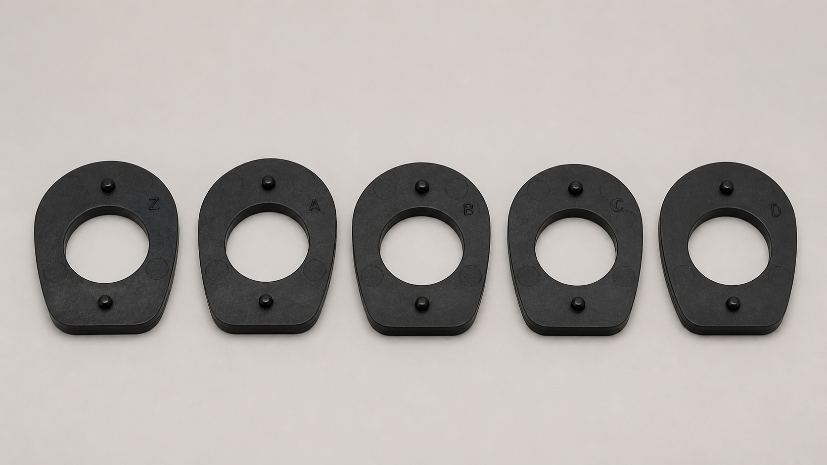 Photorealistic lineup of Z, A, B, C and D Benelli-style drop shims