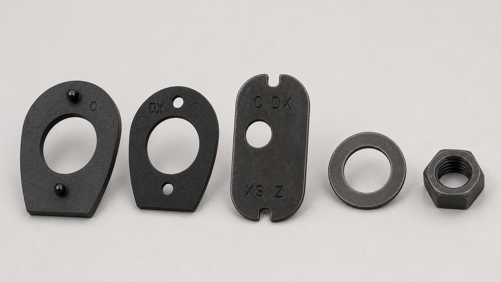 Photorealistic Benelli-style drop shim, cast shim, locking plate, washer and retaining nut arranged in order